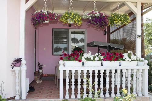 a house with flowers on the front porch at Holiday Home Peaceful Retreat in Visoko