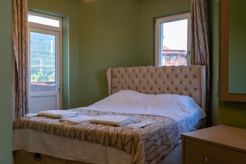 Ένα ή περισσότερα κρεβάτια σε δωμάτιο στο Greenpark Hotel