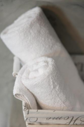 a close up of a white tie with a note at Villa Happening in Imerovigli