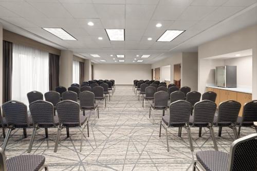 a large room with rows of chairs in it at Holiday Inn Express Greenville by IHG in Greenville