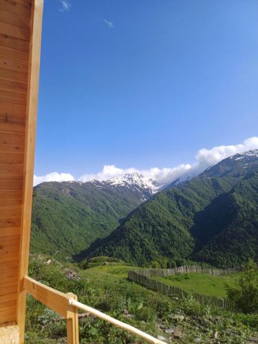 a view of the mountains from the porch of a cabin at Mariiko's cottages in Davberi