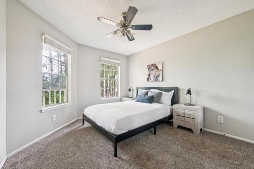 a bedroom with a bed and a ceiling fan at The Davis 1824 I Spacious 2 Bed 2 Bath in Huntsville