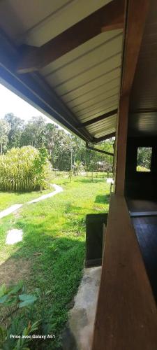 a house with a view of a field of grass at LE Gite DU TOUR DE L'ILE 
