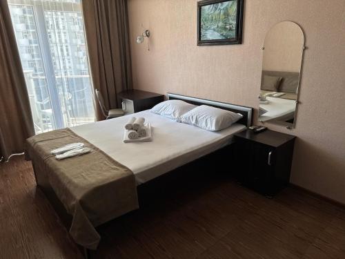 Ένα ή περισσότερα κρεβάτια σε δωμάτιο στο Orbi Towers by the Sea