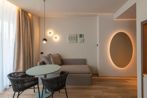 a living room with a couch and a table at International Hotel & Suite in San Benedetto del Tronto