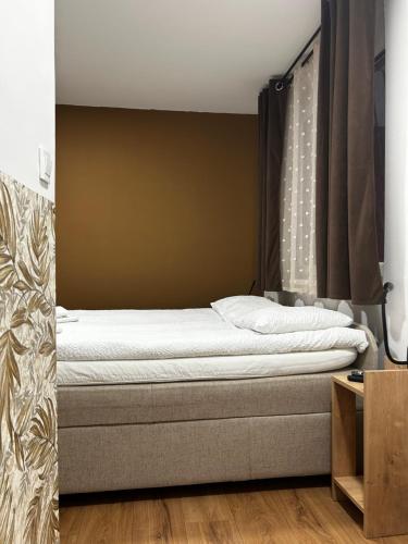 a bedroom with a bed in a room at Apartment Liriq - Free Parking in Sarajevo