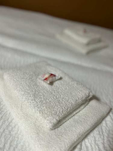 a close up of a napkin on a bed at Apartment Liriq - Free Parking in Sarajevo
