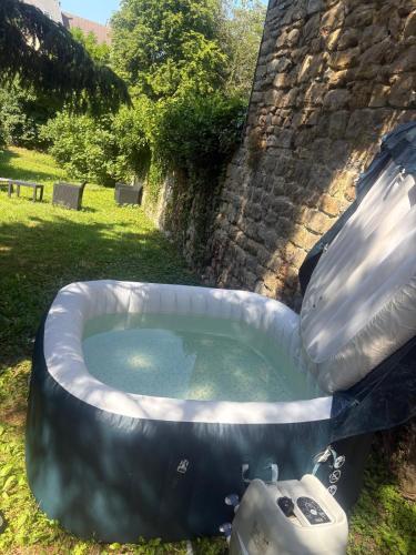 a large inflatable hot tub in a yard at HYPER CENTRE AVEC JARDIN 47m2 COSY in Boulogne-sur-Mer