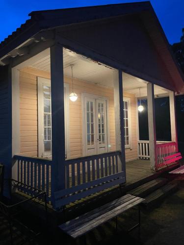 a screened in porch of a house at night at Örserumsbrunn Gestgifveri & Konferens in Gränna