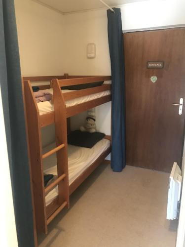 Llit o llits en una habitació de l'HELIANTHEME