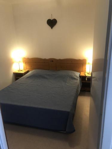 Llit o llits en una habitació de l'HELIANTHEME
