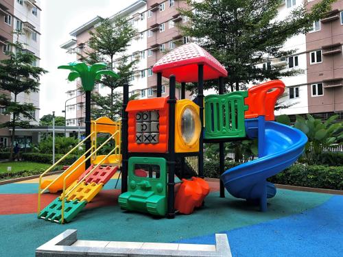 a childrens playground with a slide at Elim Escape Staycation in Trece Martires