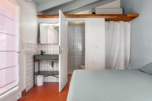 Ένα ή περισσότερα κρεβάτια σε δωμάτιο στο Chambres d'hôtes - La Moustelle