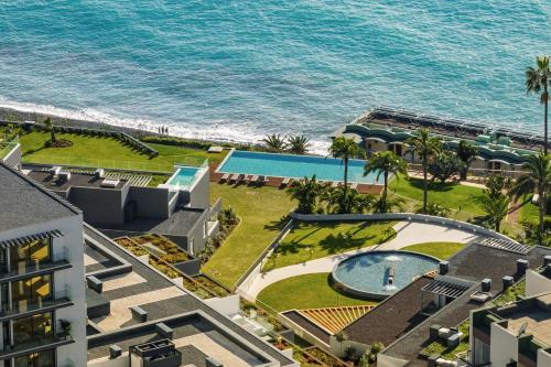an aerial view of a resort with a swimming pool and the ocean at Acqua Residence VI by An Island Apart in Funchal