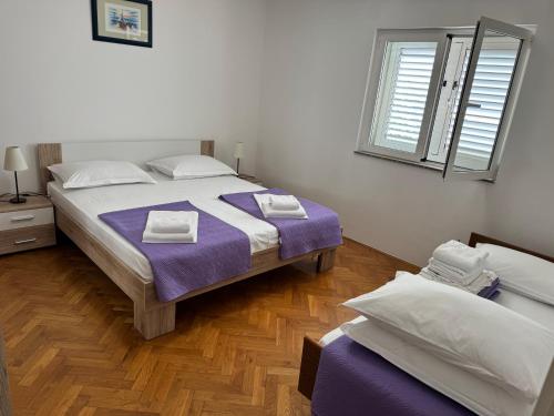 Posteľ alebo postele v izbe v ubytovaní Apartments Marta - Zadar - near the sea