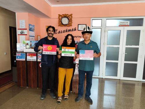 a group of three people holding up certificates at Tagaytay Karakol Hotel in Karakol