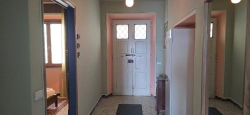a hallway with a door and a room with two doors at La Casa del Tramonto in Vellano