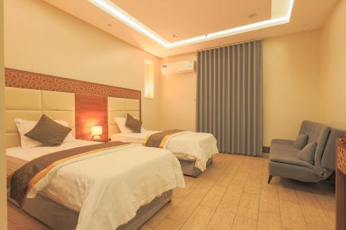 Postel nebo postele na pokoji v ubytování Velvet Resort