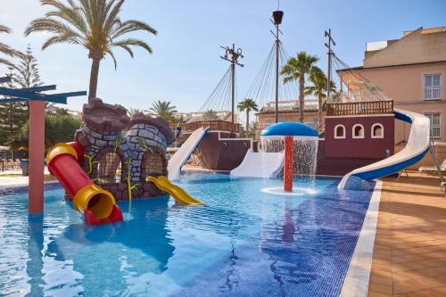 a swimming pool with a water park with slides at Zafiro Can Picafort in Can Picafort