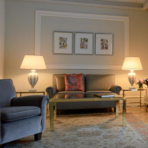 a living room with a couch and two chairs at Colombi Hotel in Freiburg im Breisgau