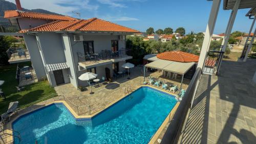 an aerial view of a house with a swimming pool at Aliston Hotel Thassos in Skala Potamias