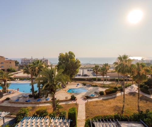 an aerial view of the pool at the resort at H&O Sea & Sun Apartment in Paphos City