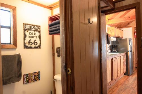 an open door to a bathroom in a tiny house at Lakeview Cedar Cabin - Kicks 66 - 4 in Mead