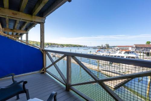 a balcony with a view of a marina at Fisherman's Wharf Inn in Boothbay Harbor