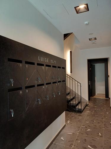 a locker room with lockers in a building at Luise LuXe Suites in Tallinn