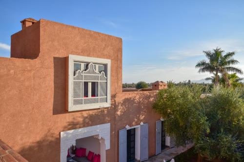 a building with a window on the side of it at Dar Syada Boutique Hotel Marrakech in Marrakech