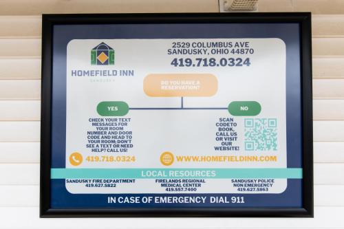 a framed poster of the in case of emergency bill at HomeField Inn in Sandusky