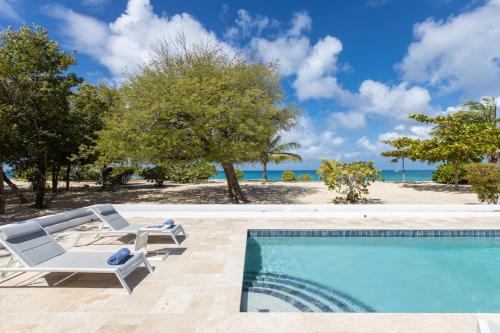 an image of a swimming pool at a villa at The Beach Bungalow Sisters in Baie Longue