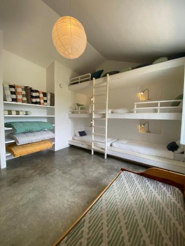 a room with two bunk beds and a glass floor at Monte do Álamo da Serra in Redondo