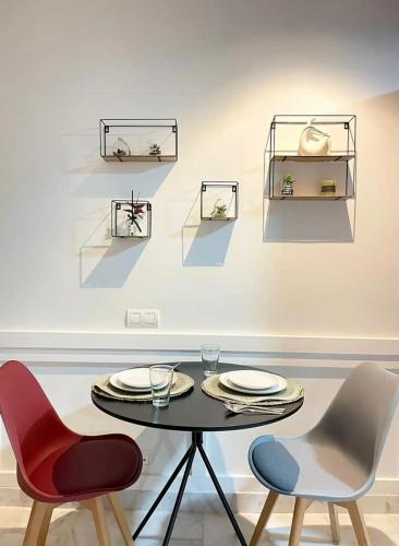 a dining room with a table and two chairs at A102 Studio cosy & chic in Casablanca