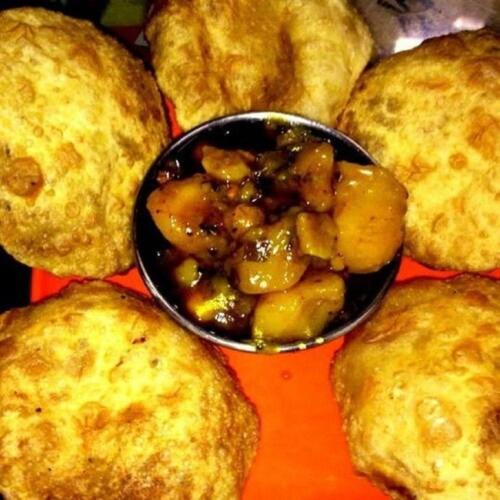 a bowl of food sitting on top of pies at Hotel C G Newly Built 2 Mins From Connaught Place and Railway Station & 5 Mins From VFS Shivaji Stadium Metro Station in New Delhi