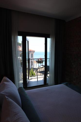Postel nebo postele na pokoji v ubytování Sardinia Otel