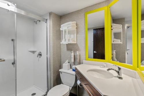 a bathroom with a toilet and a sink and a shower at Hampton Inn Princeton in Princeton