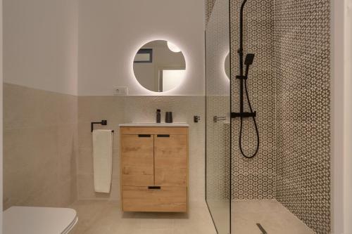 a bathroom with a shower and a toilet and a sink at Kokomo beachfront in Cotillo