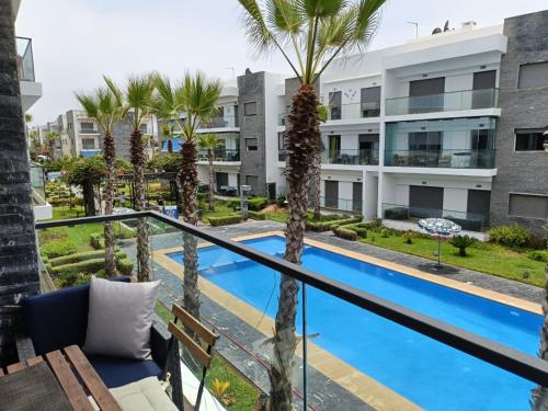 Kolam renang di atau dekat dengan GARDEN BAY Appartement Luxe Front de Mer à Tamaris Sidi Rahal, Plage Privée, Piscine et Loisirs