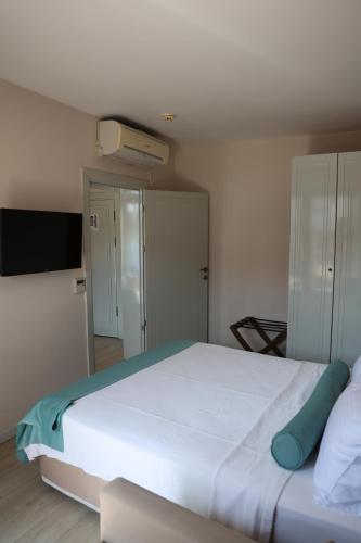 Postel nebo postele na pokoji v ubytování Sardinia Otel