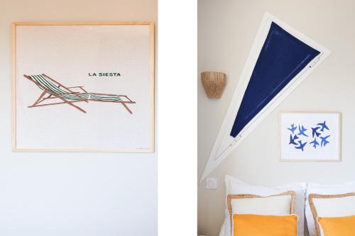une pièce avec une photo d'une chaise et une photo encadrée dans l'établissement VAUBAN appartement Antibes, à Antibes