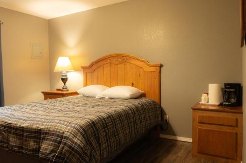 a bedroom with a bed with two pillows on it at Lakeview Room 2 Queens - 20 in Mead