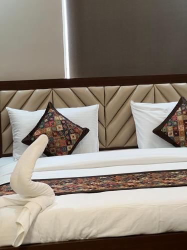 Postel nebo postele na pokoji v ubytování RJ-02 Hotel