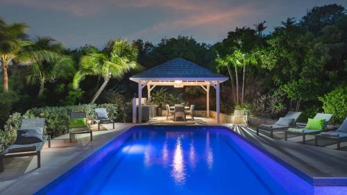 a swimming pool with a gazebo and a gazebo at Private Villa With Astonishing View Of Hills in Pointe Milou