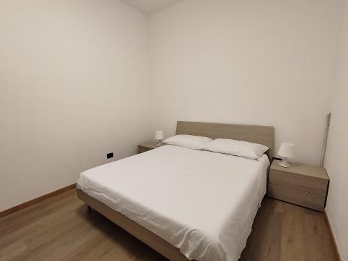 Postel nebo postele na pokoji v ubytování Delfini Apartment