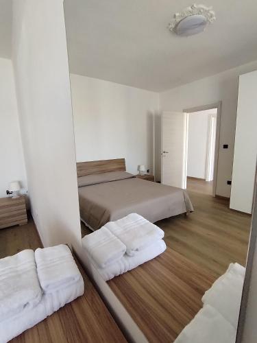 Postel nebo postele na pokoji v ubytování Delfini Apartment