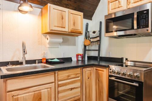 a kitchen with a sink and a microwave at Cabana Del Lago - 39 in Mead