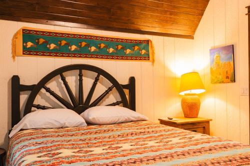 a bedroom with a bed with a wooden head board at Cabana Del Lago - 39 in Mead