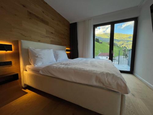 Ένα ή περισσότερα κρεβάτια σε δωμάτιο στο ELSA Spa Apartments Tux