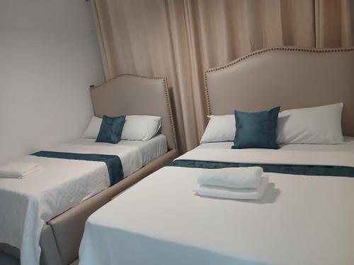 Ένα ή περισσότερα κρεβάτια σε δωμάτιο στο Bahari Suites